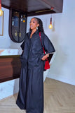 Black oversized shirt and wide-leg pants two-piece set, side view