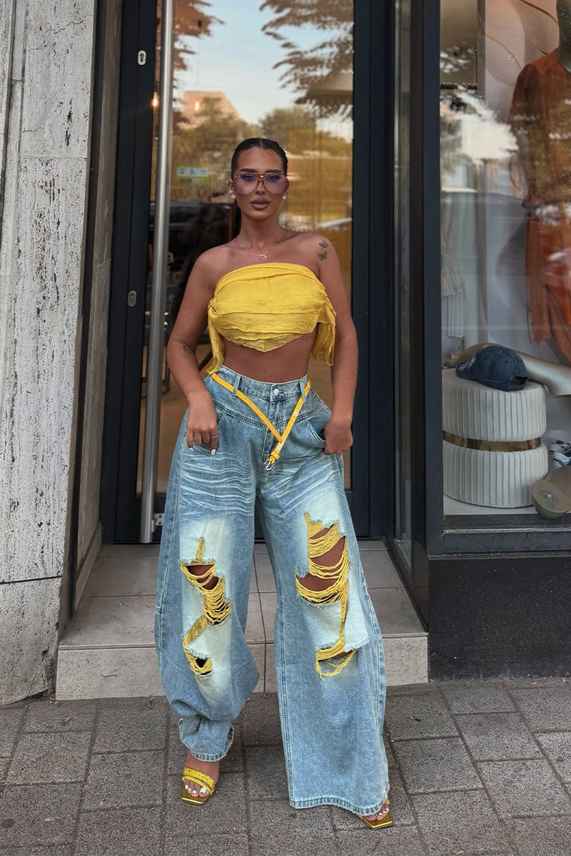 Light wash distressed wide leg jeans front view